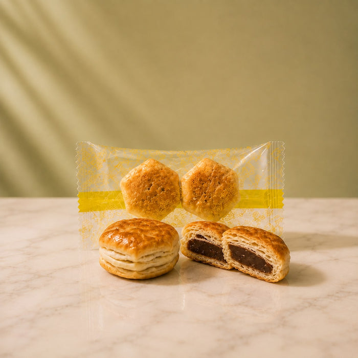 Pai no Mi unwrapped — small flaky pastry pieces filled with chocolate.