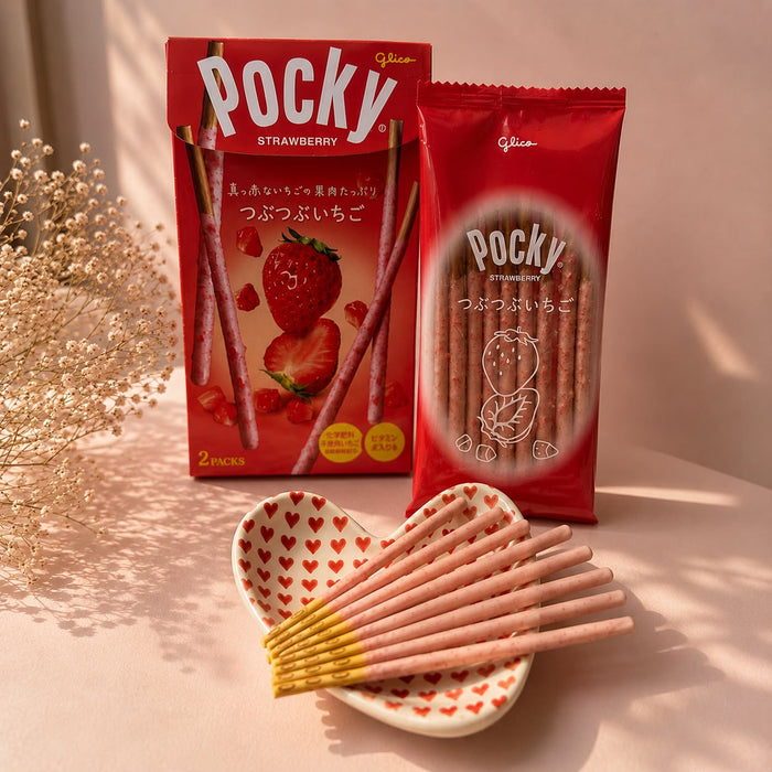 Strawberry Pocky out of the box — thin biscuit sticks coated in pink strawberry cream.