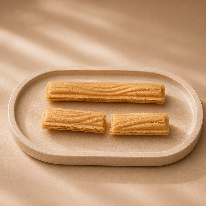 Elise Hokkaido milk wafers out of the wrapper, thin cream-filled wafer bars.