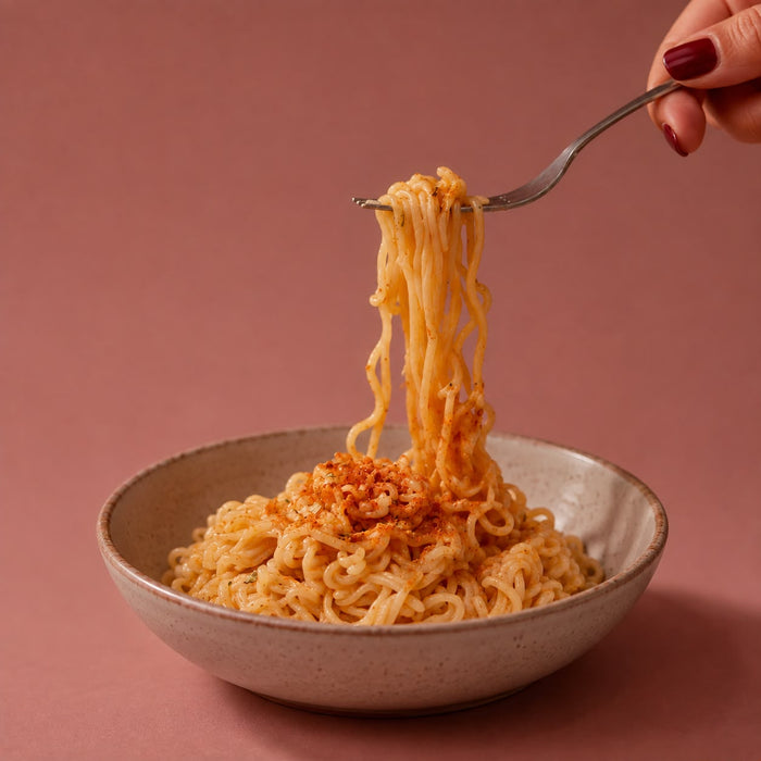 Tonkotsu-style ramen after cooking, springy noodles in a creamy spiced broth.